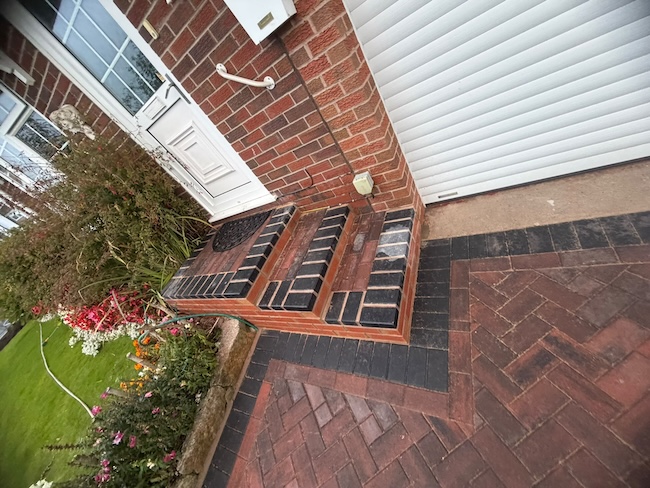 Block paved garden path beside a Kidsgrove home