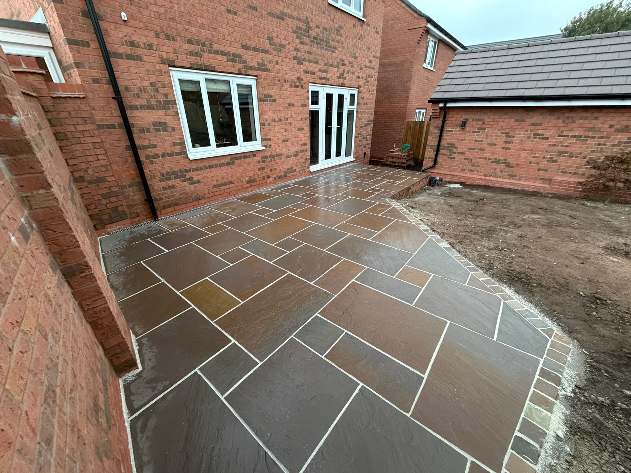 Sandstone patio installation in Congleton by Age Paving Ltd